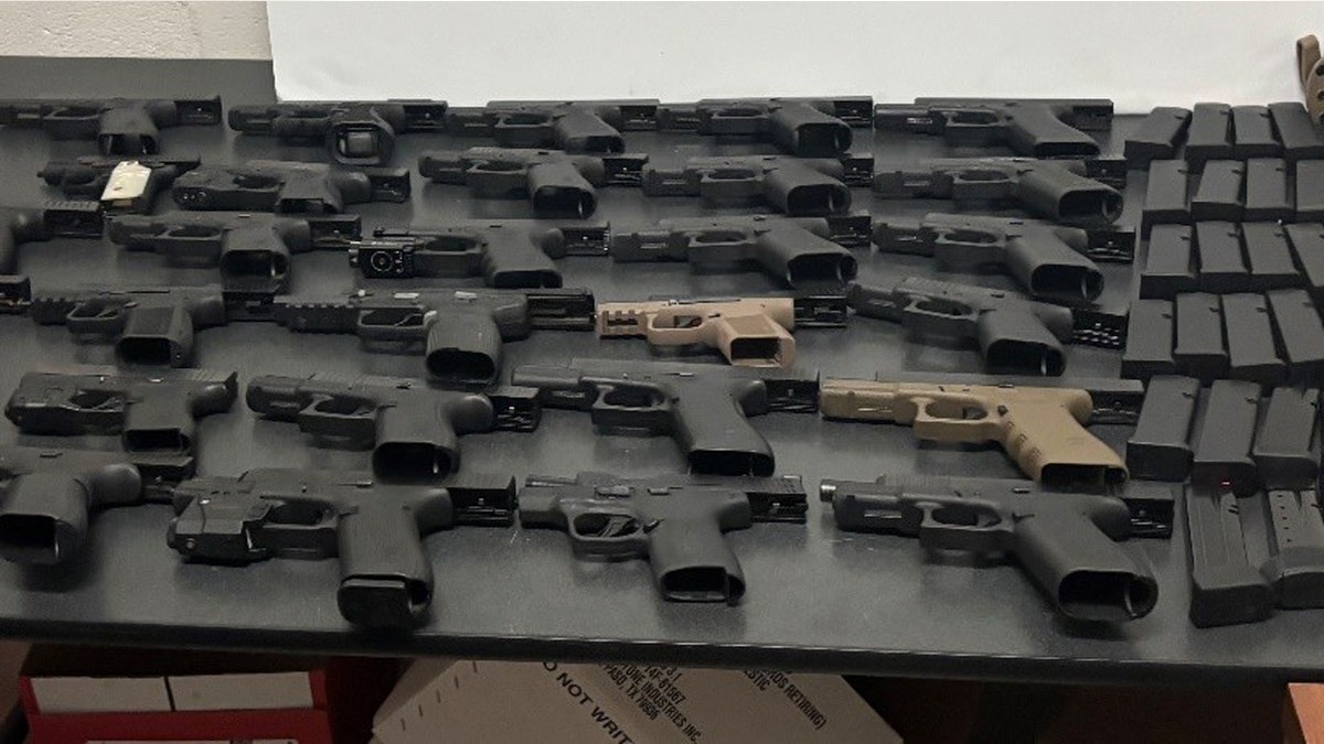 Two arrested after dozens of guns, including 'cop-killer' model, found in spare tire at southern border: DPS at george magazine