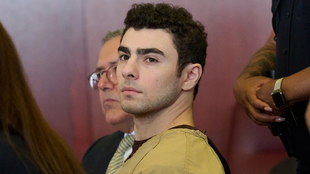 Accused CEO assassin Luigi Mangione asks judge to toss evidence from his arrest  at george magazine