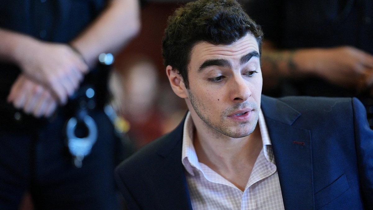 Luigi Mangione said 'all these people here for a mass murder, why?' at arraignment: police officer  at george magazine