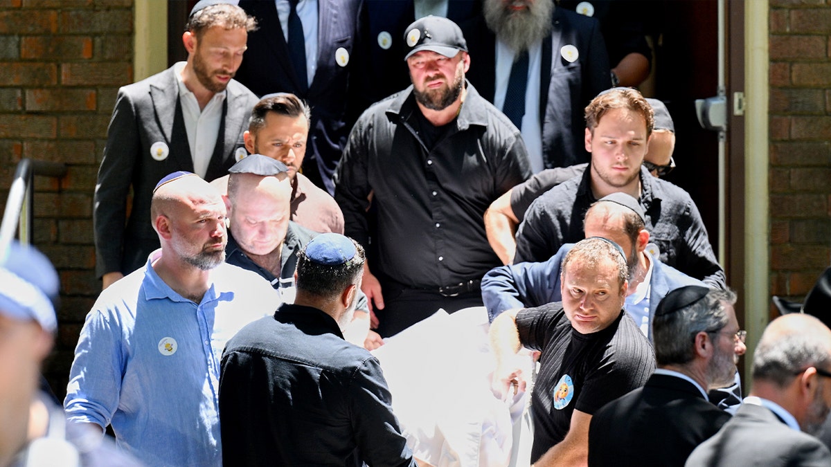 Australia anti-terror police detain 7 men as country lays youngest Bondi Beach victim to rest at george magazine