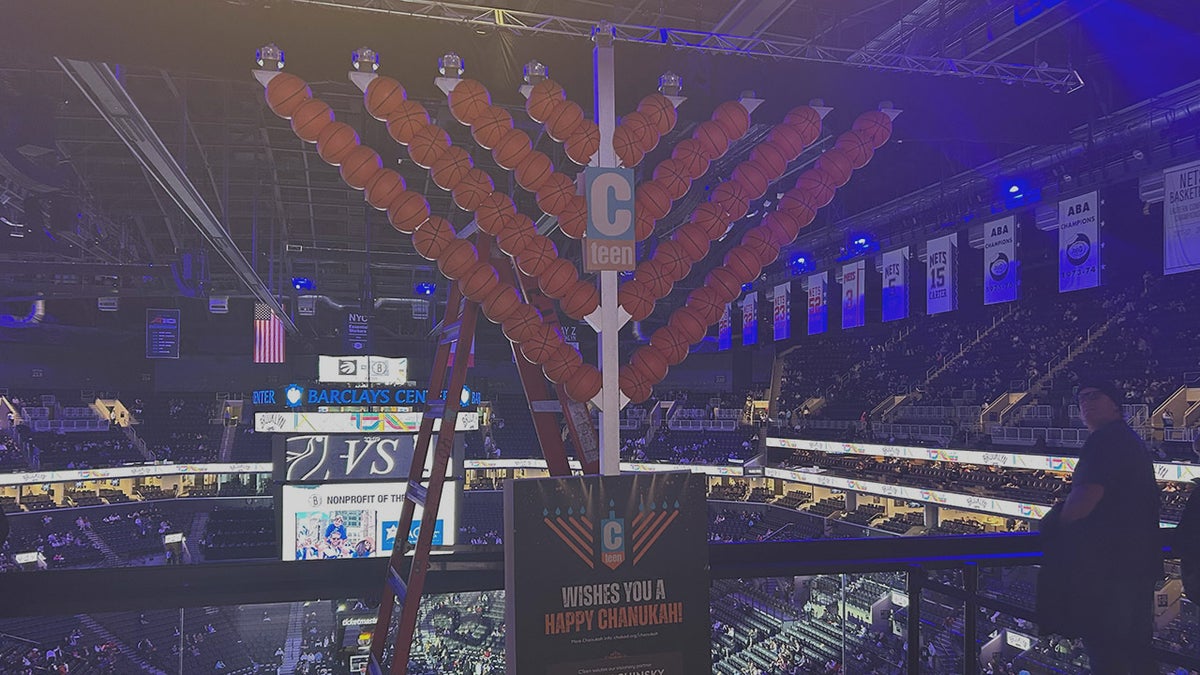 Nets honor Australia Hanukkah attack victims, light menorah during game at george magazine