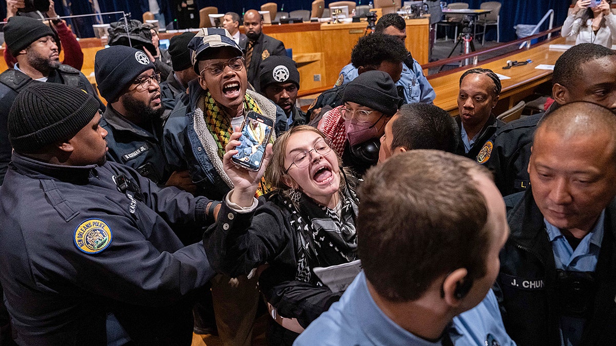 Anti-ICE protesters storm New Orleans council meeting, unleashing chaos amid immigration crackdown  at george magazine