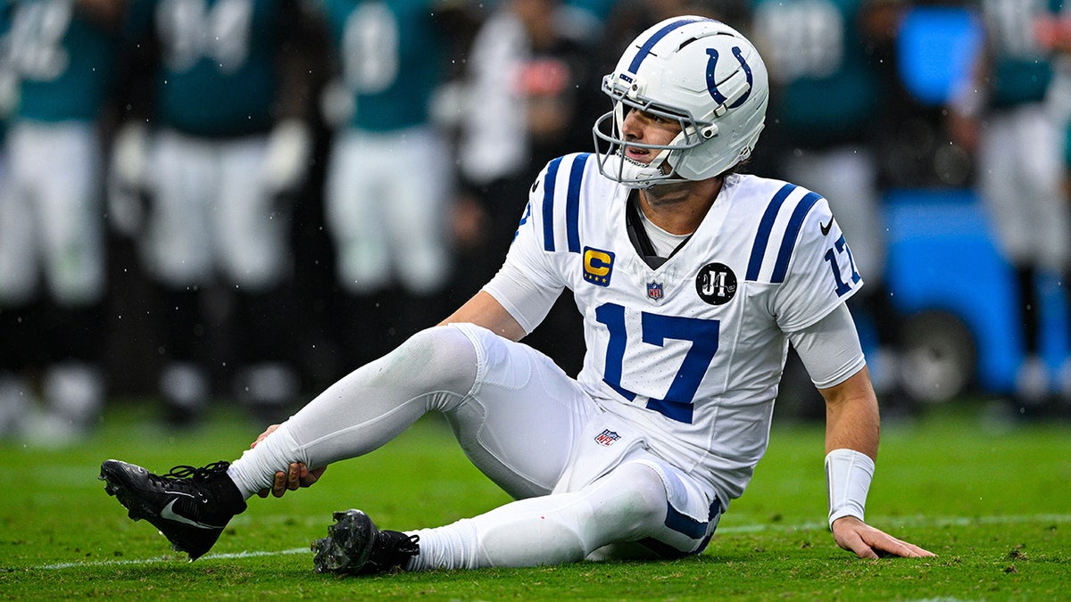 Colts' Daniel Jones slams helmet in frustration as he suffers gruesome Achilles injury  at george magazine