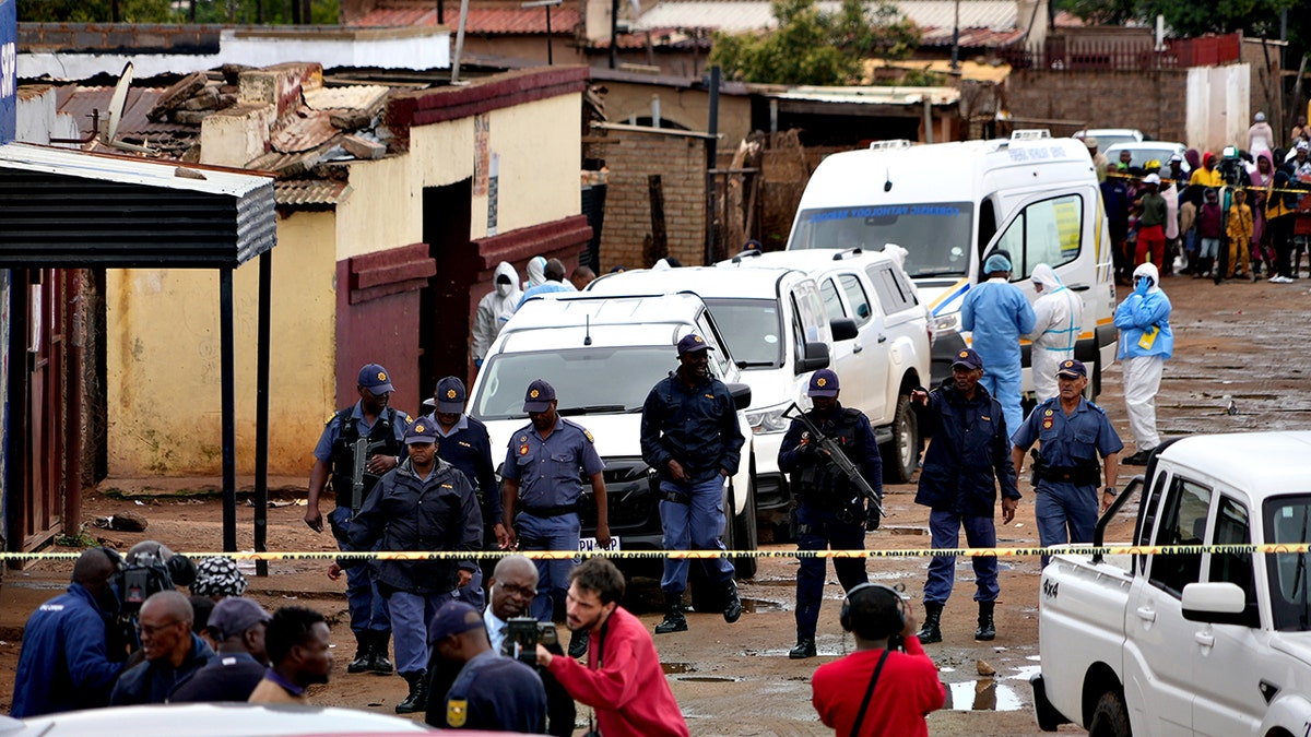 Manhunt underway in South Africa after gunmen open fire at tavern, killing 9 and wounding 10 at george magazine