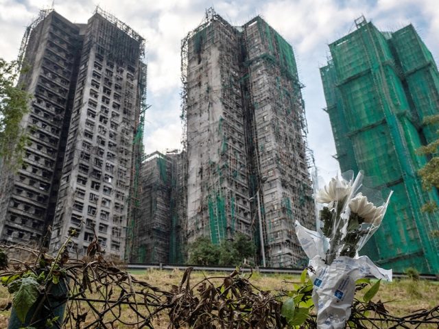 Hong Kong leader says ‘we must uncover the truth’ after deadly apartment fire, calls for building reform