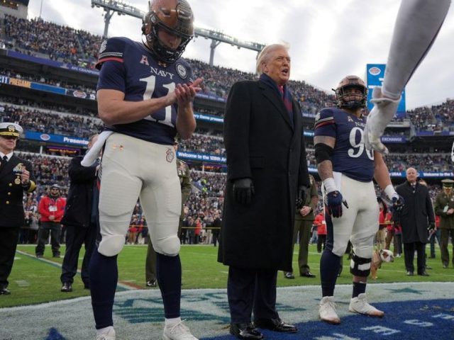 Trump takes the field at Army-Navy game for coin toss, military flyover