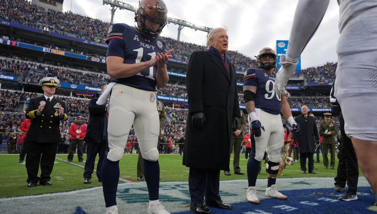 Trump takes the field at Army-Navy game for coin toss, military flyover at george magazine