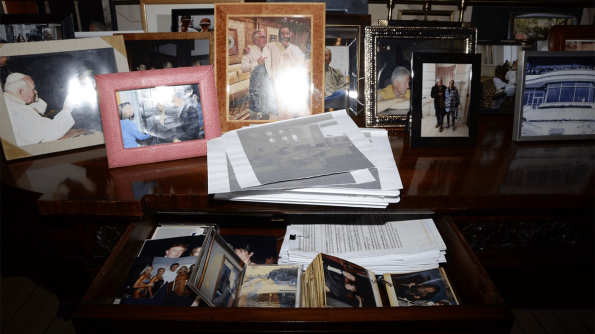 DOJ restores Trump photo to Epstein files after determining no victims depicted at george magazine