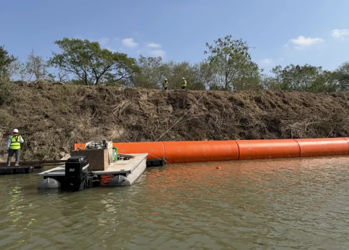 First look at wall of buoys installed in river at Texas border at george magazine