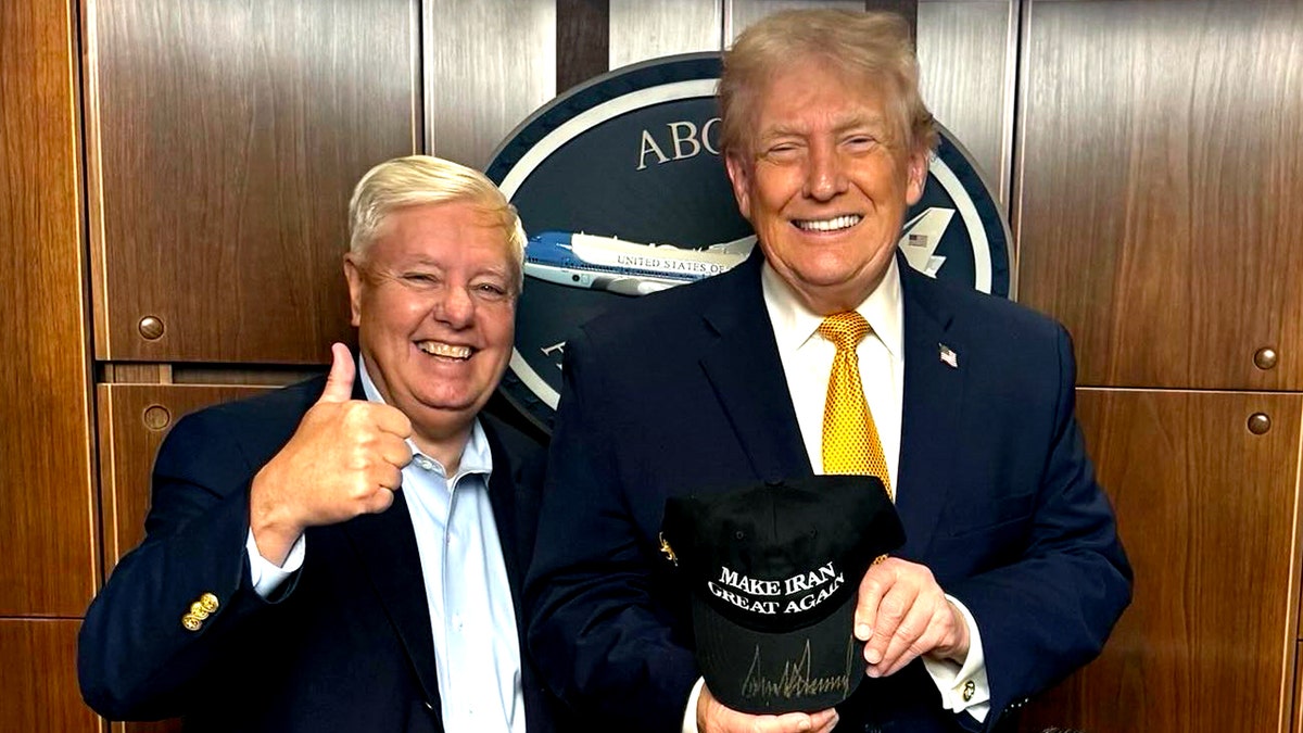 Trump signs 'Make Iran Great Again' hat alongside Lindsey Graham at george magazine
