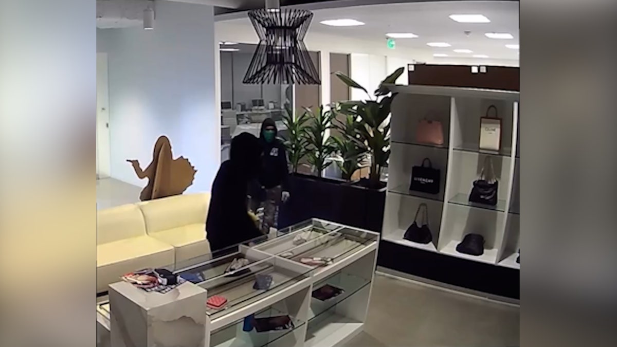 Massive luxury handbag heist caught on camera as heavily armed police swarm California store at george magazine