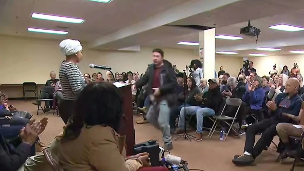 Ilhan Omar sprayed by unknown substance after man charges her at Minneapolis town hall at george magazine