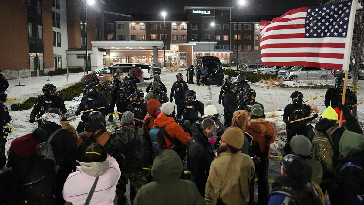 Anti-ICE agitators arrested outside Minnesota hotel as police declare unlawful assembly: 'No longer peaceful' at george magazine