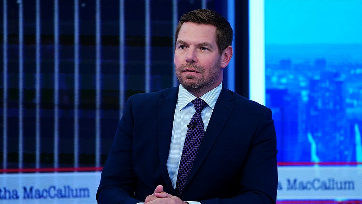 Swalwell threatens to revoke driver's licenses of masked ICE agents operating in California at george magazine