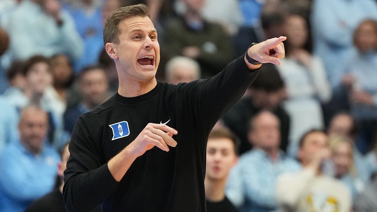 Duke staffers 'got punched in the face' as UNC fans stormed court after upset win, coach says at george magazine