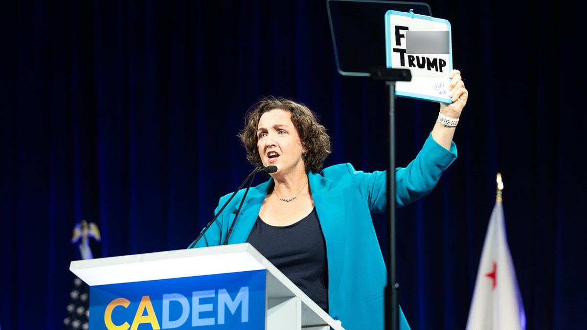 Katie Porter holds ‘F--- TRUMP’ sign at California Democratic convention at george magazine