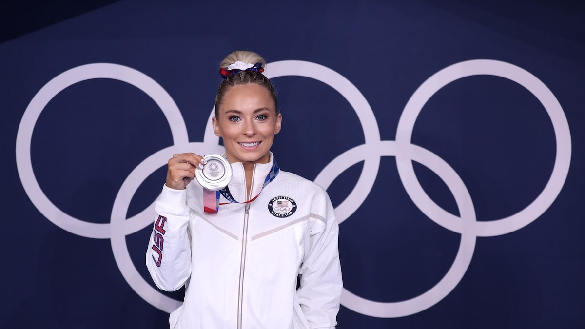 American Olympic medalist speaks out against judges amid controversy in figure skating competition at george magazine