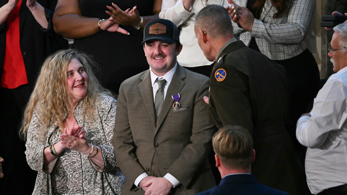 Trump awards Purple Hearts to National Guard members ambushed in Washington, DC: 'We love you all' at george magazine