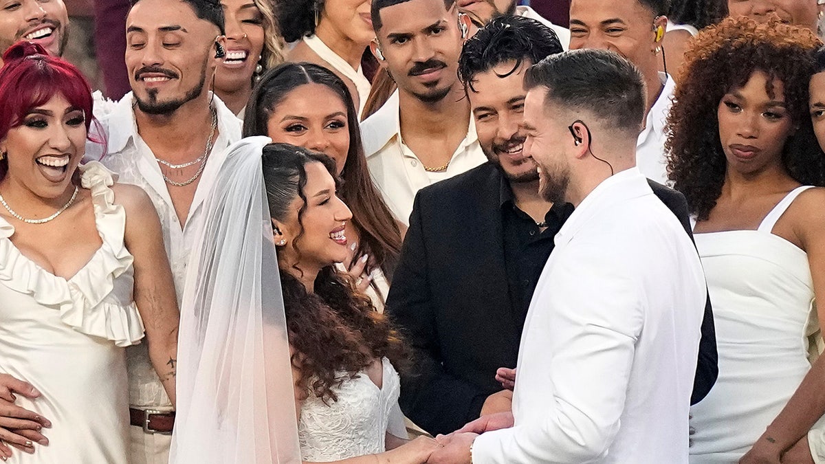 Couple shown during Bad Bunny's Super Bowl halftime show got legally married during the performance: reports at george magazine