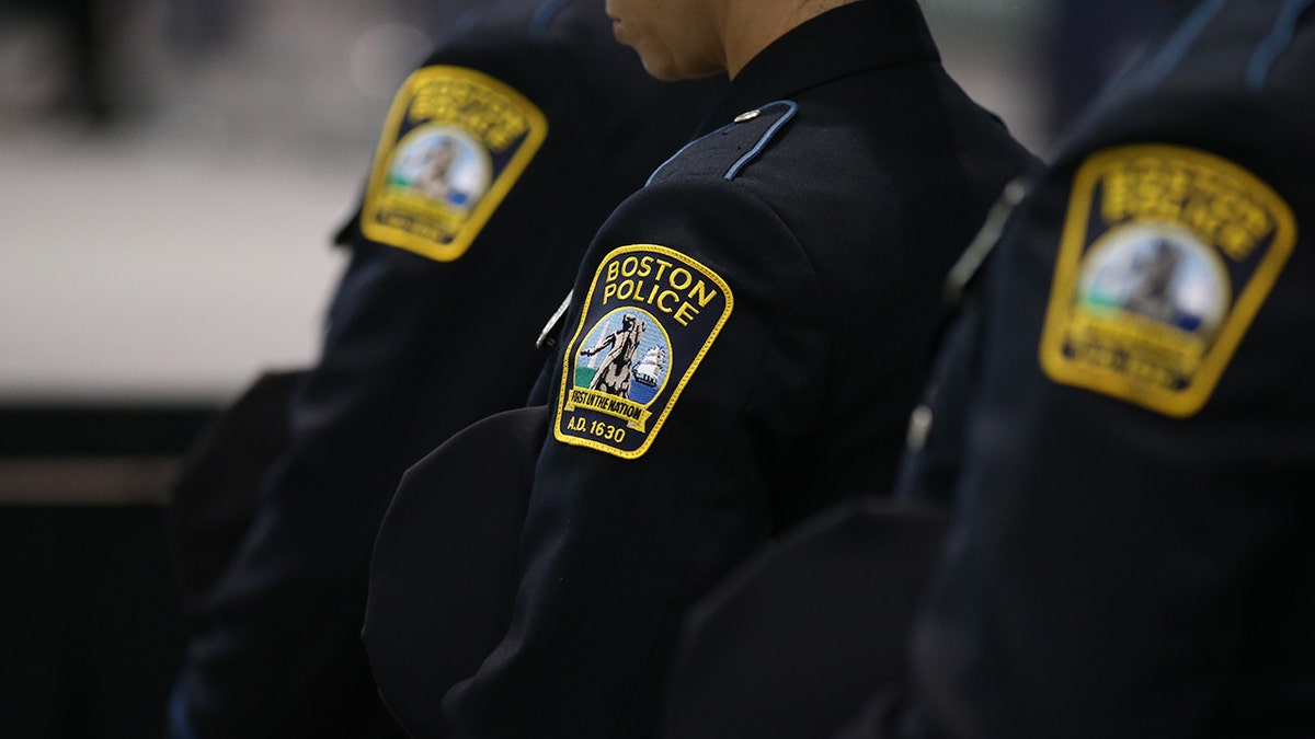 Boston officer charged with manslaughter after shooting carjacking suspect as video disputes account at george magazine