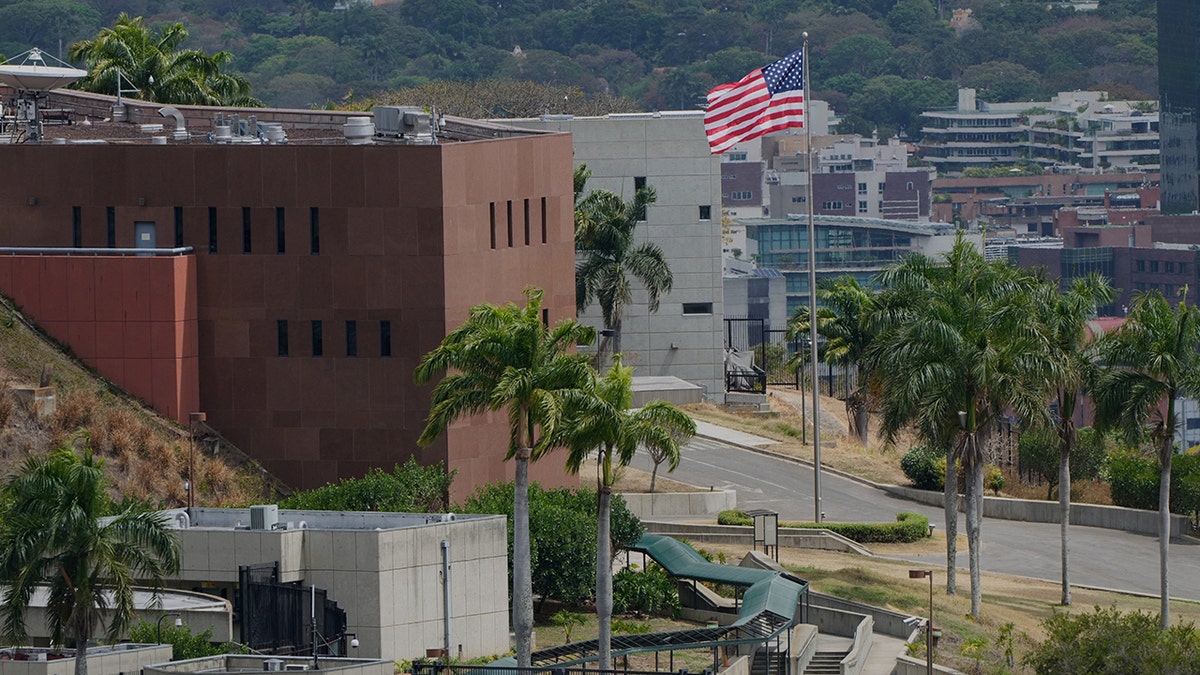 American flag raised, flies over US Embassy building in Venezuela for first time in 7 years at george magazine