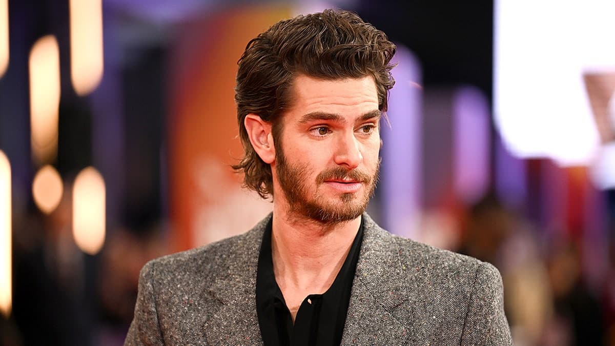 Andrew Garfield poses on red carpet at London Film Festival event.