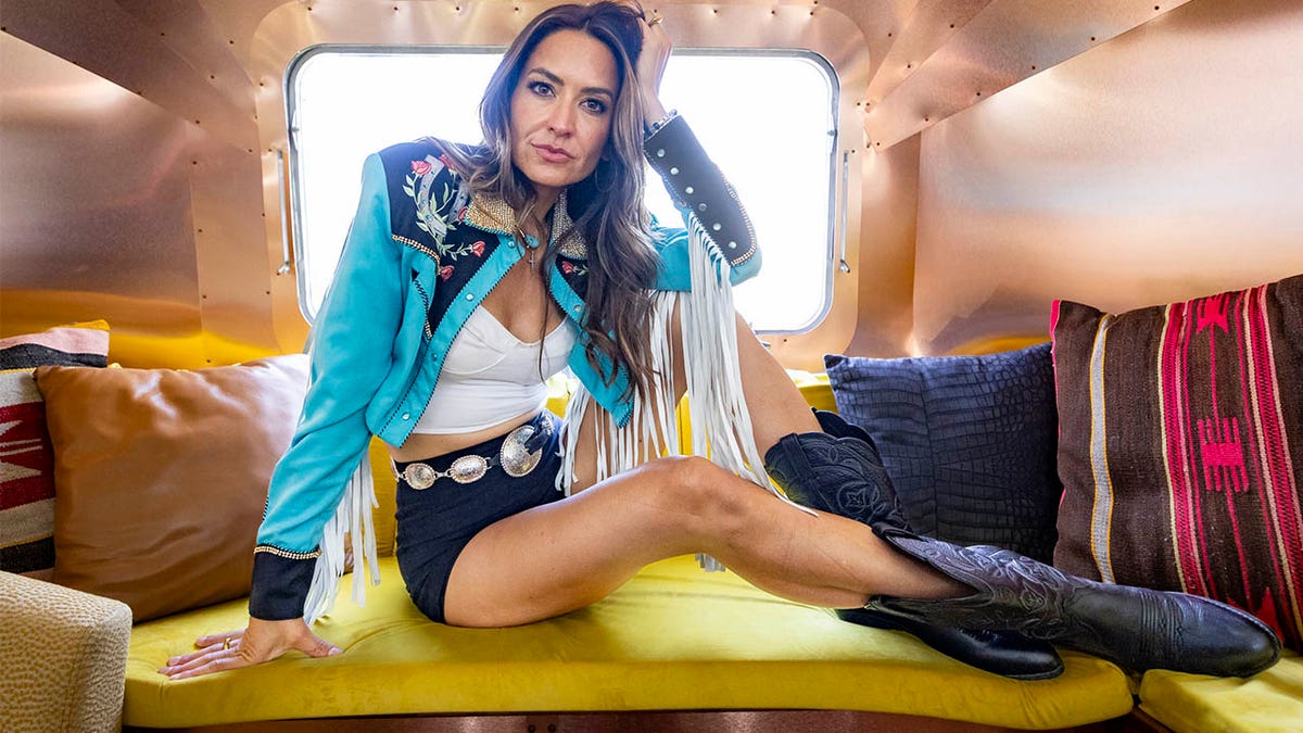 Annie Bosko posing in the back of a van