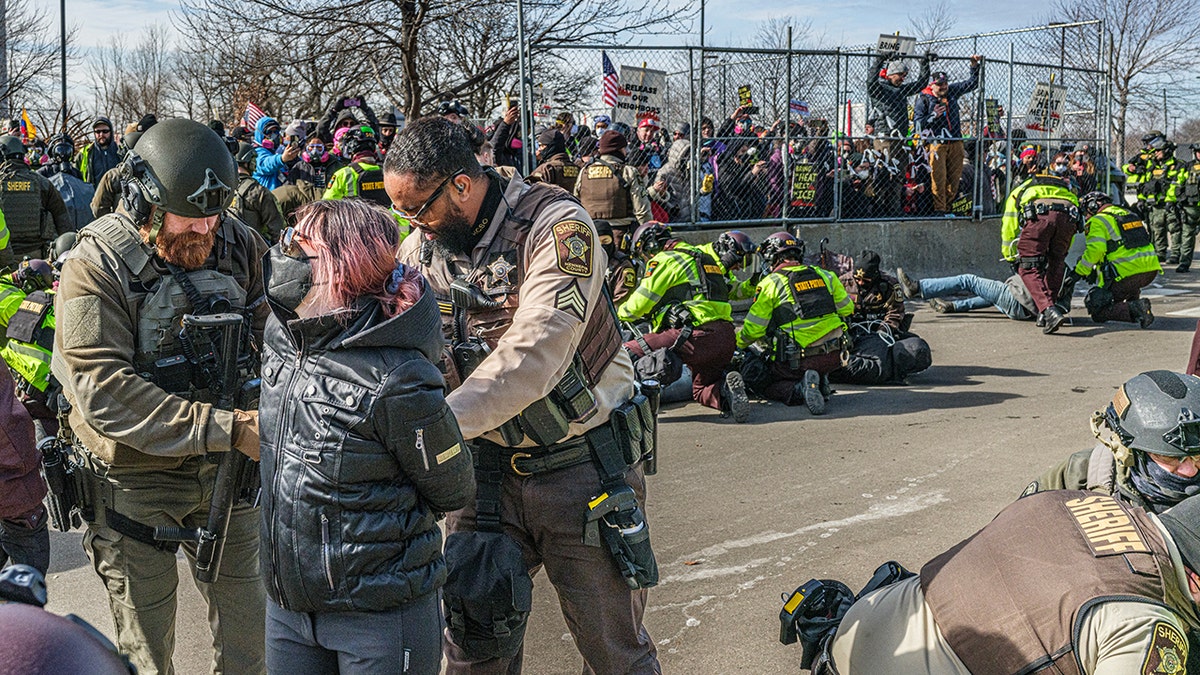 Over 50 arrested as anti-ICE protesters allegedly hurl rocks at Minneapolis officers during demonstration at george magazine