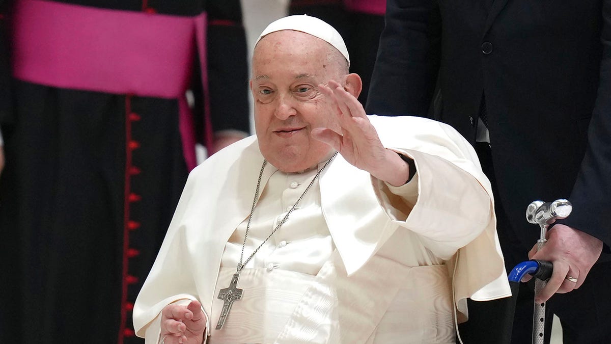 Pope Francis waves as he arrives for his weekly general audience in 2025.