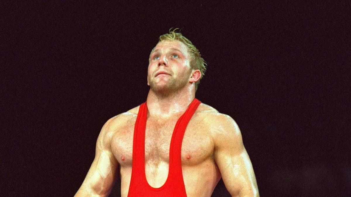 Olympians speak out against Iran's public execution of champion wrestler Saleh Mohammadi at george magazine