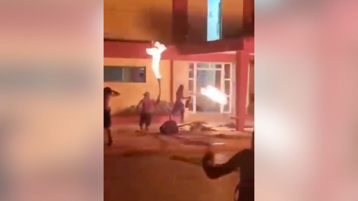 Protesters torch Communist Party HQ in Cuba as video appears to capture gunfire at george magazine