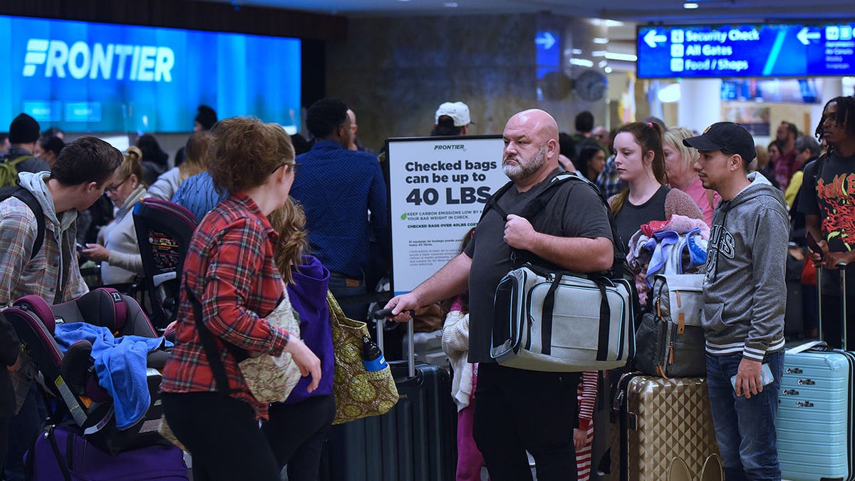 Out-of-control airline passenger caught on video ripping into flight crew in 'sad' meltdown at george magazine