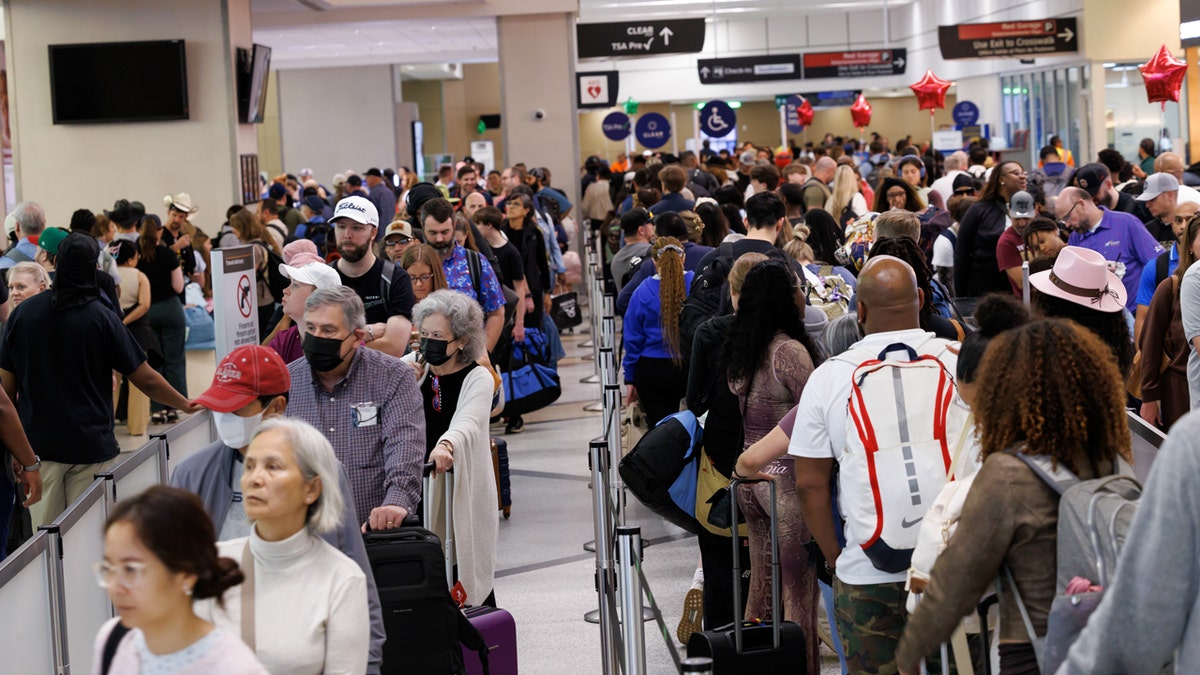 Shutdown sparks flight chaos as TSA lines spill into parking lots with 3-hour waits or longer at george magazine