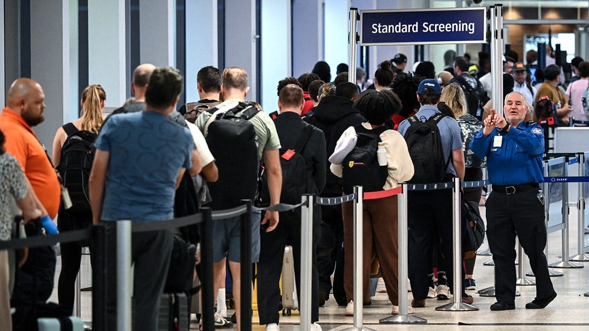 Travelers waiting in long line at George Bush Intercontinental Airport.
