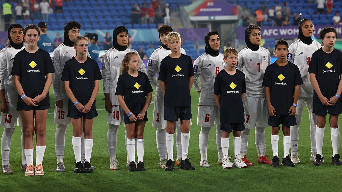 Iranian women's soccer team refuse to sing national anthem in silent protest at Asian Cup at george magazine