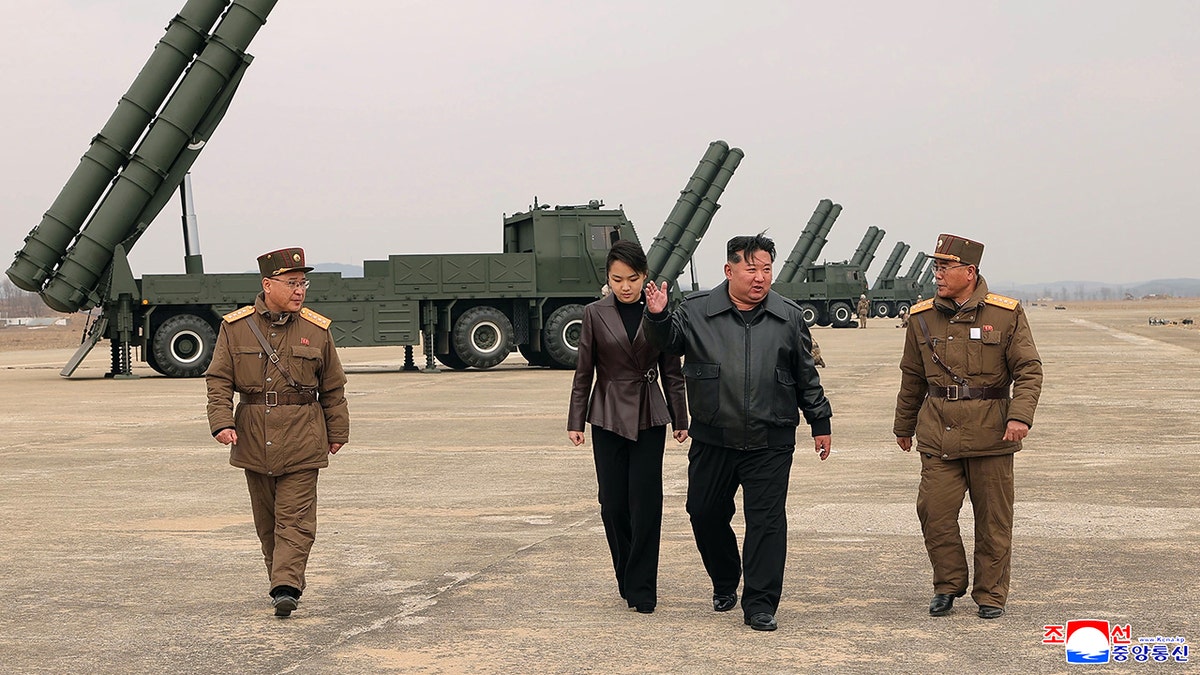Kim Jong Un appears with teenage daughter at live-fire rocket test in North Korea at george magazine