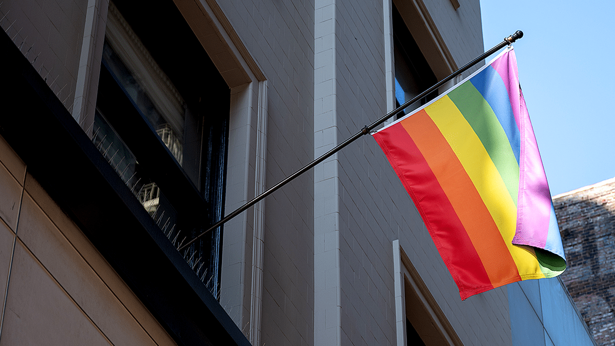 Rainbow flag hangs outside a building