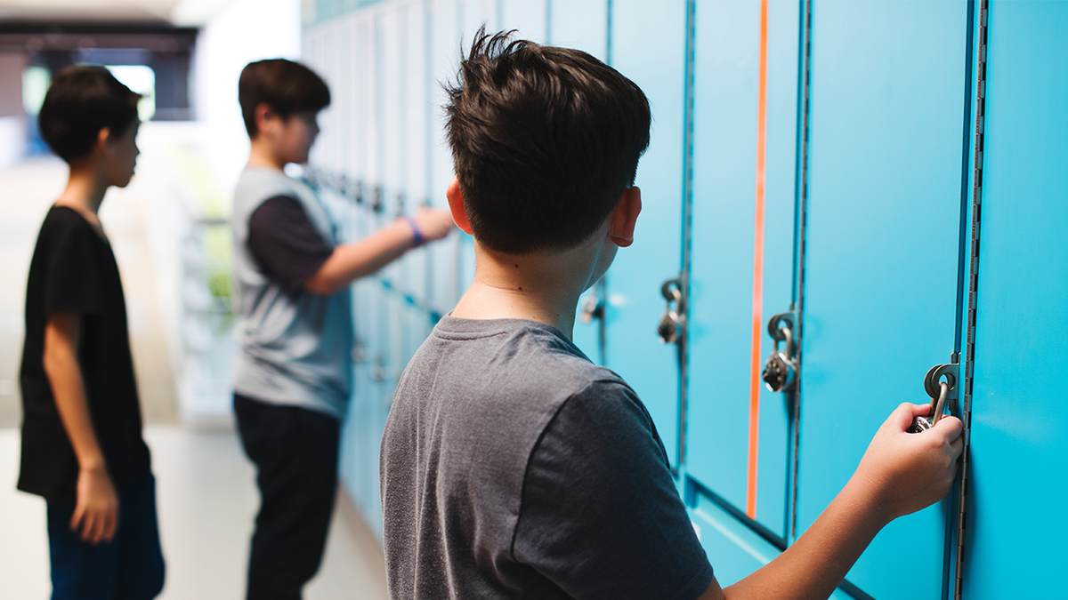 School board settles with boys accused of sexual harassment over transgender student locker room incident at george magazine