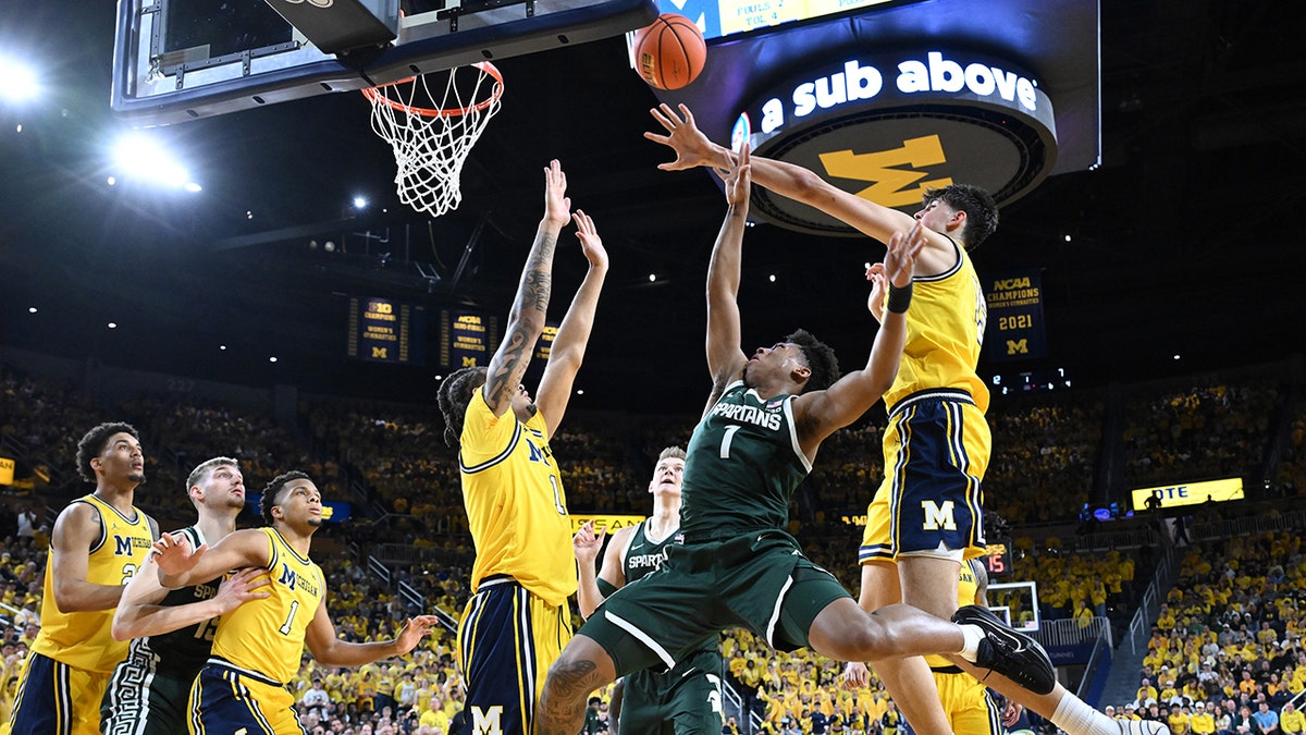 Michigan State star draws fresh scrutiny with kick toward opponent's groin at george magazine