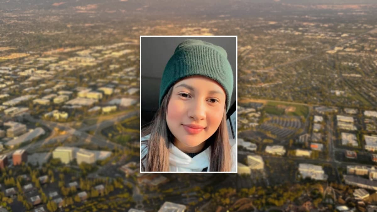 Kembery Chirinos-Flores in front of the Santa Clara, CA skyline.