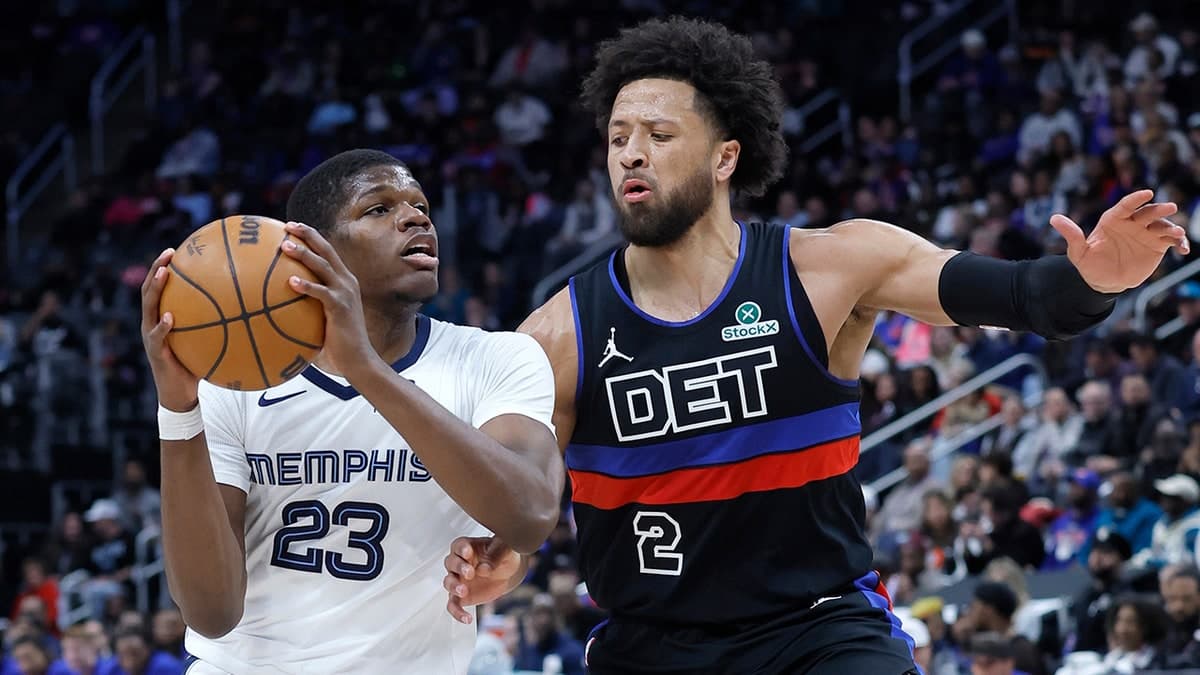 Cade Cunningham defends against a Grizzlies player