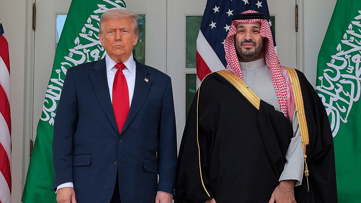 U.S. President Donald Trump (L) and Crown Prince and Prime Minister Mohammed bin Salman of Saudi Arabia pause for photographs along the West Wing Colonnade at the White House on November 18, 2025 in Washington, DC.
