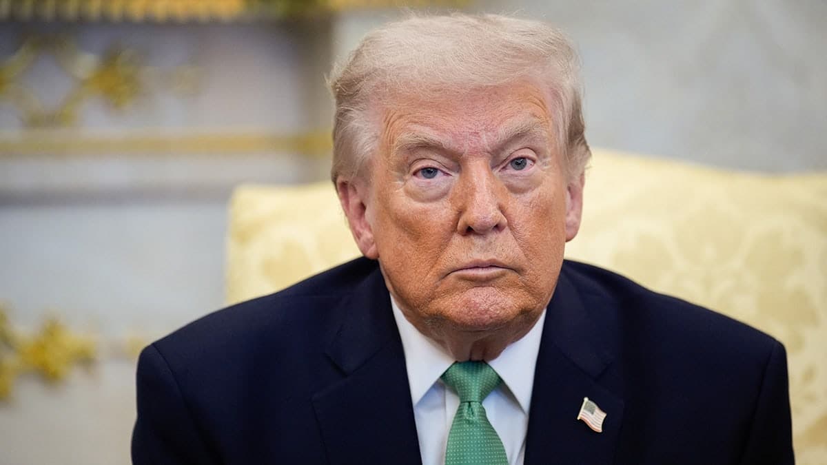 President Trump sits in the Oval Office