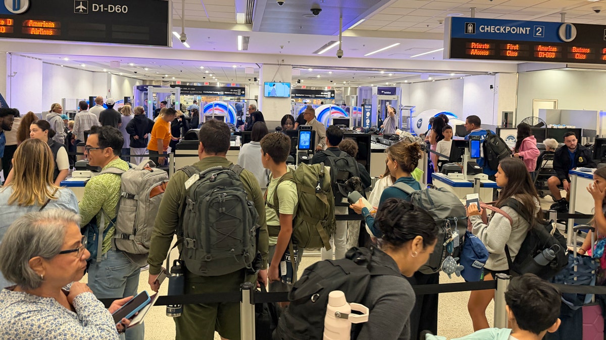 Flight passengers in TSA line at Miami Airport