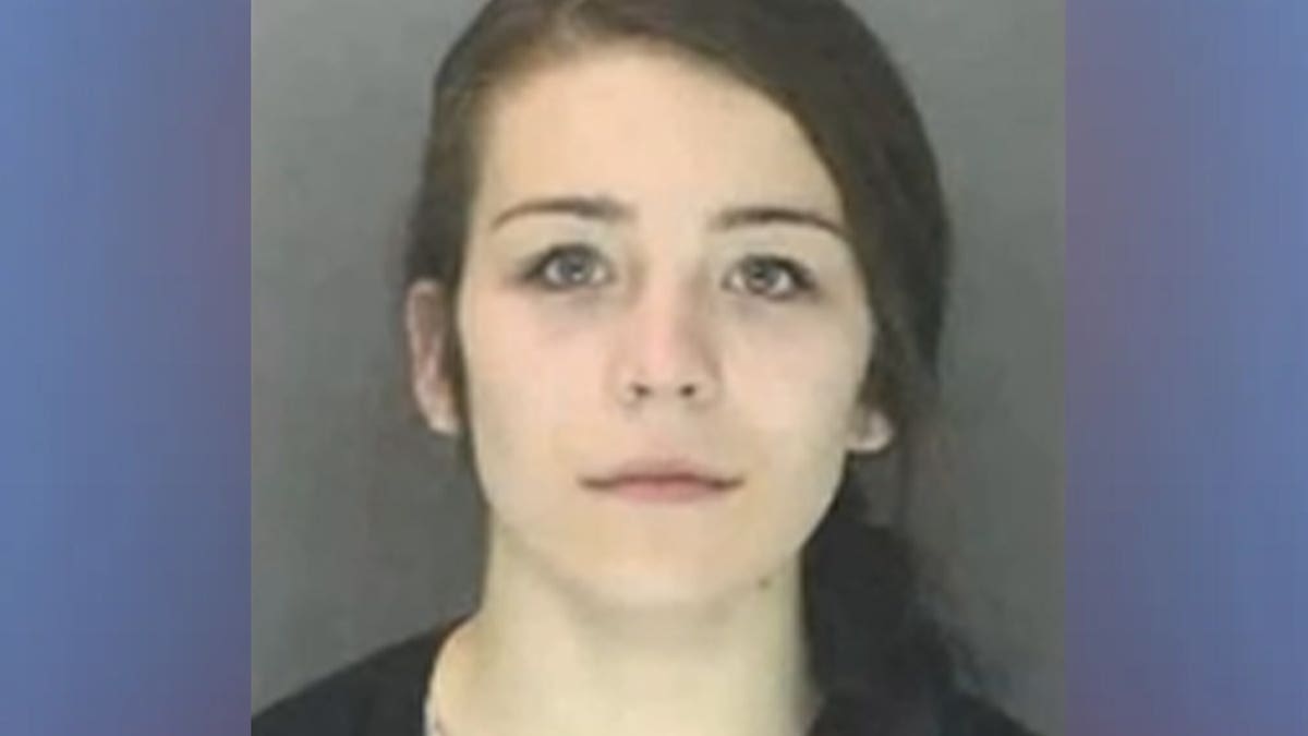 A mugshot of Arissa Ward wearing a black shirt