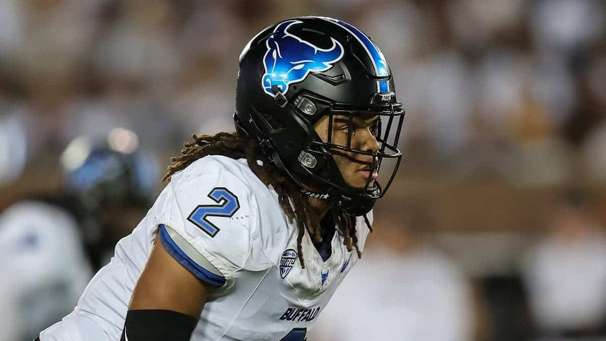 Buffalo Bulls linebacker Red Murdock running on football field during game