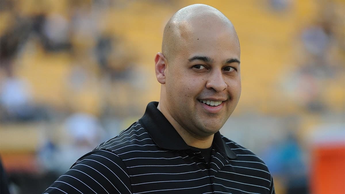 Omar Khan standing on the sideline at Heinz Field during a football game.