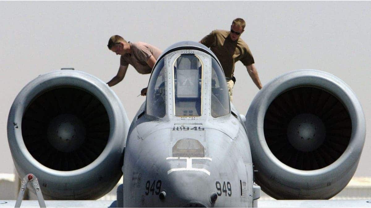 U.S. Air Force ground maintenance crewmen inspecting A-10 Thunderbolt Warthog engines at air base