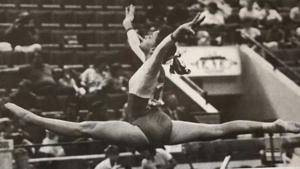 Jennifer Sey performing a split leap in gymnastics