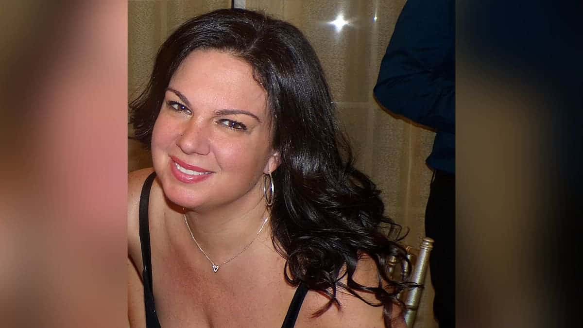 profile of dark haired woman smiling